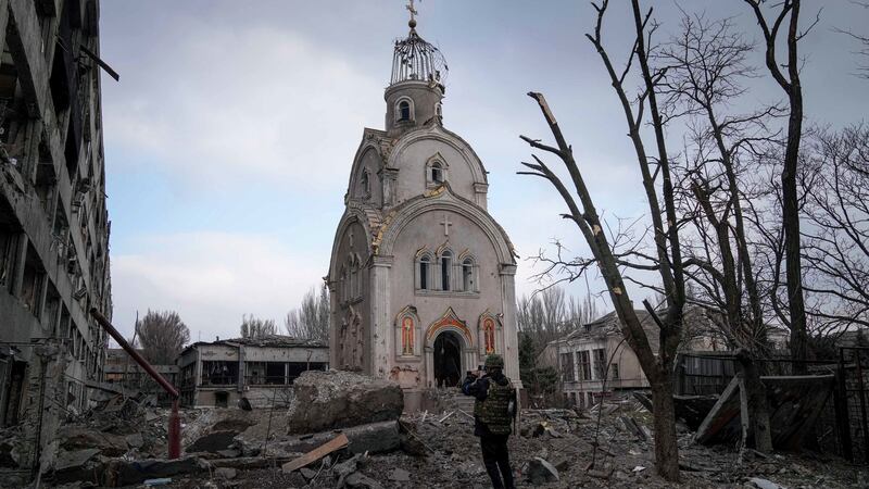 A Ukrainian serviceman takes a photograph of a damaged church after shelling in a residential district in Mariupol, Ukraine, Thursday, March 10th, 2022. Photograph: Evgeniy Maloletka/AP