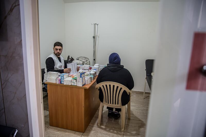 A woman has a consultation during a mobile health clinic set up by Médecins Sans Frontières in Wadi al-Zayni, Lebanon. Photograph: Sally Hayden