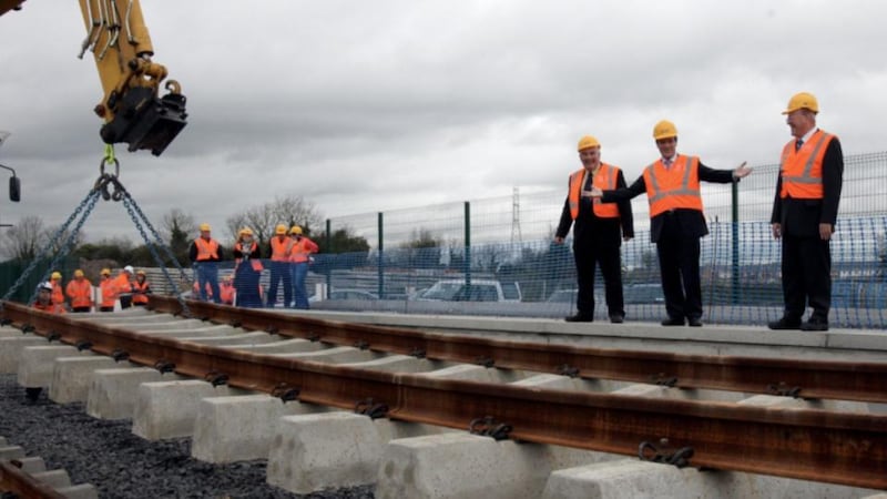 The then minister for transport 0Noel Dempsey and former chairman of CIE Dr John Lynch mark the first track being laid on the Dunboyne Commuter Railway at Hansfield Station in October 2009.
