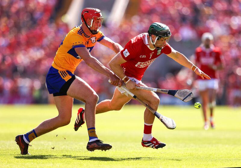 Cork's Mark Coleman is challenged by Clare's Peter Duggan. Photograph: Tom O'Hanlon/Inpho