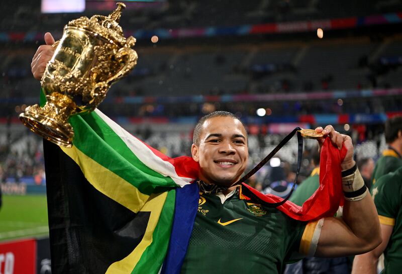 Cheslin Kolbe of South Africa celebrates with the The Webb Ellis Cup following the Rugby World Cup final. Photograph: Dan Mullan/Getty Images