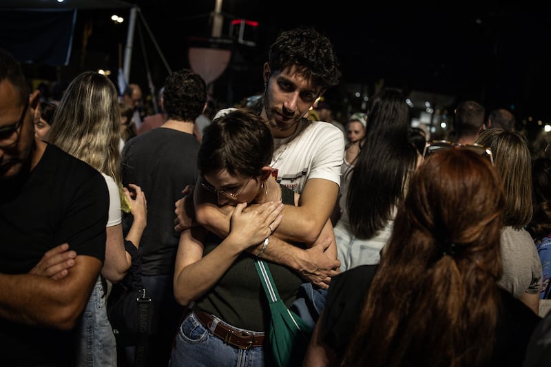 A couple embraces at Hostage Square in Tel Aviv on Thursday evening. Photograph: John Wessels/AFP via Getty Images          