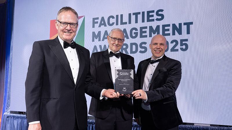 Jim Perry, national key account manager at EWL Electric, presents the best building & workplace performance award to Mark Adrain and William Adams, Henderson Group Property