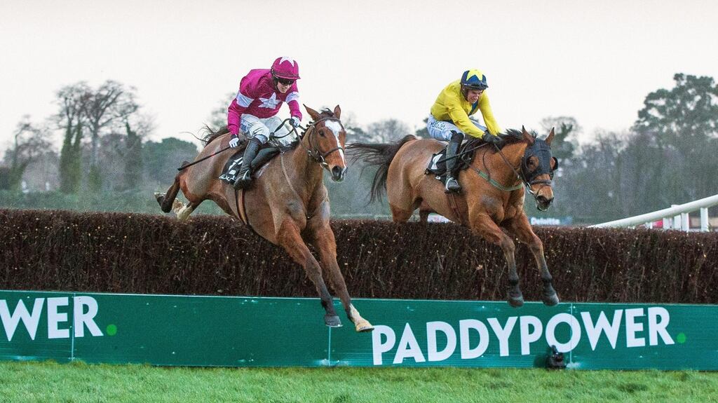 Bryan Cooper on Don Poli outjumps Adrian Hesking on Foxrock en route to victory in the Lexus Chase at Leopardstown at Christmas. Photograph: Morgan Treacy/Inpho