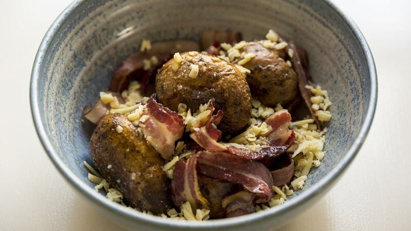 Baked potatoes. Photograph: Emma Jervis
