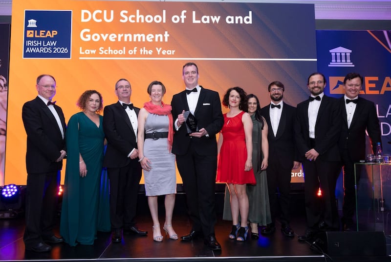 Richard Hammond, solicitor and partner at Hammond Good and chair of the judging panel of the Leap Irish Law Awards; Ann McGarry, judge at Leap Irish Law Awards; Derek Hand, executive dean of the Faculty of Humanities and Social Sciences at DCU; Michael Breen, associate professor in international political economy at DCU; Christy Ann Petit, assistant professor in European Law at DCU: Emma McEvoy, assistant professor in Law at DCU; Edoardo Celeste, associate professor of law, technology and innovation at DCU; Goran Dominioni, assistant professor in climate change law and policy; and Anton Savage, MC of the night. Photograph: Paul Sherwood