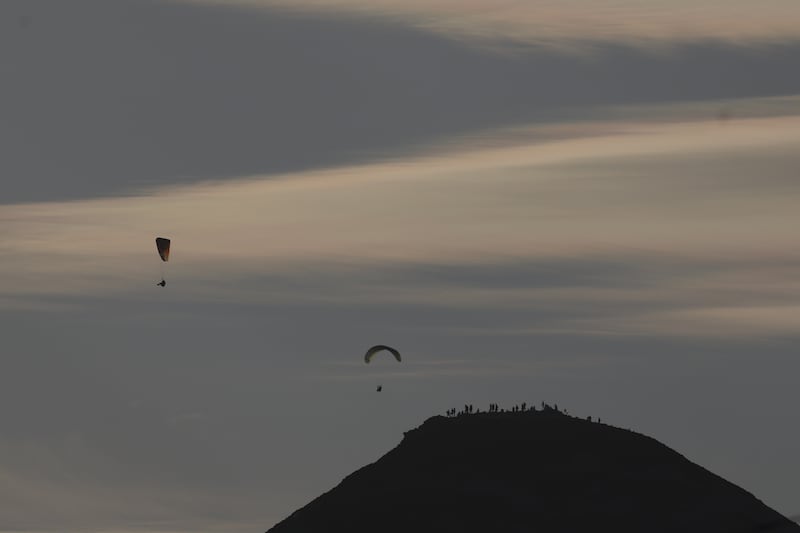 Handgliders and eclipse watchers on the summit of the Sugerloaf in county Wicklow this evening. Photograph by Nick Bradshaw