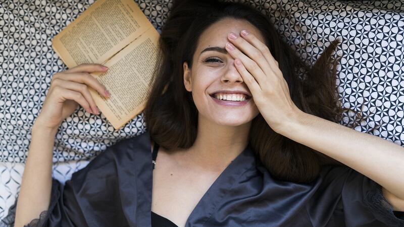 I want a list of books that are guaranteed to distract and entertain me, that will  put a smile back on my face, that might even make me laugh out loud. Photograph: Getty Images