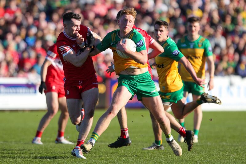 Donegal's Oisin Gallen and Derry's Diarmuid Baker in action in Celtic Park. Photograph: Lorcan Doherty/Inpho