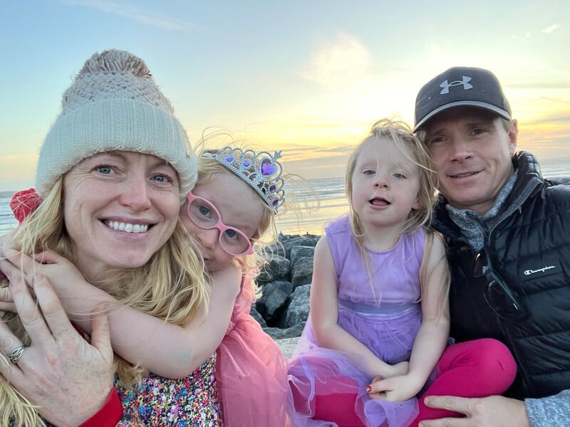 Sue Redmond and Mike Hughes, with their twin girls Azahra & Zianna.