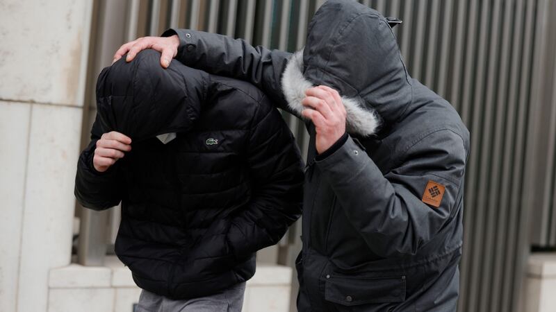 Darragh Lyons (left) leaves Dublin District Court after he was charged with assault causing harm in Ballyfermot. Photograph: Alan Betson