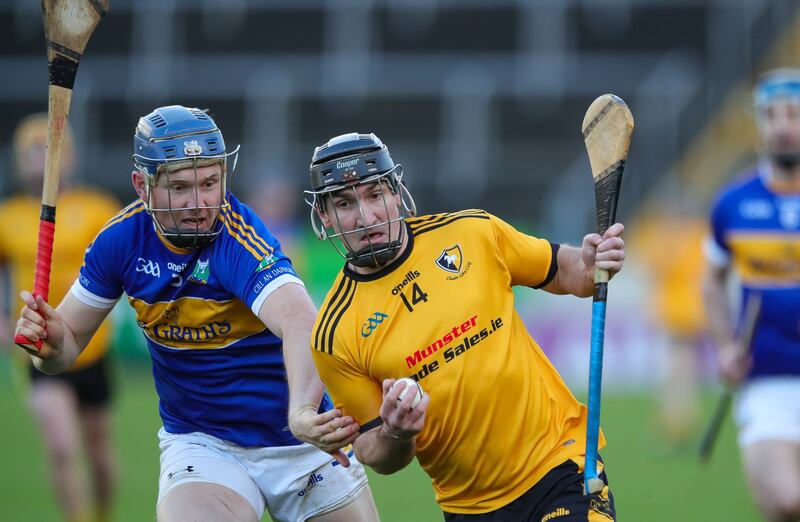 Ian Galvin of Clonara takes on David Sweeney of Kiladangan.  Photograph: Natasha Barton/Inpho