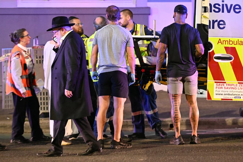 Health workers put a patient into an ambulance after a shooting incident at Bondi Beach in Sydney. Photograph: Saeed Khan/AFP via Getty Images