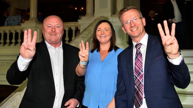 Frank McCoubrey, Nicola Verner and Brian Kingston of the DUP celebrating success at Belfast City Hall. Photograph: Mark Marlow/PA Wire
