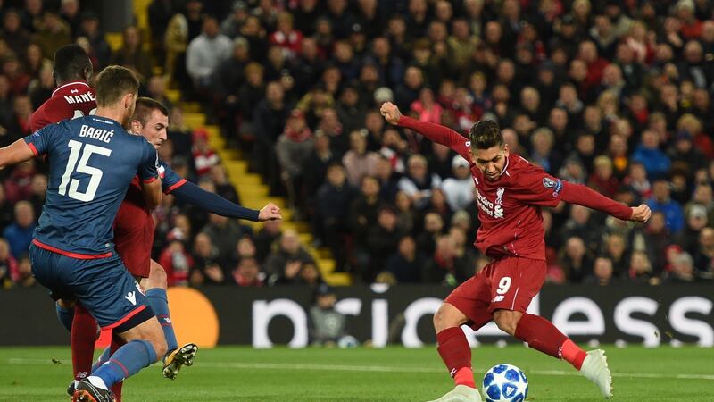 Liverpool’s  Roberto Firmino   opens the scoring in the Champions League Group C  match against  Red Star Belgrade at Anfield. Photograph: Oli Scarff/AFP/Getty Images