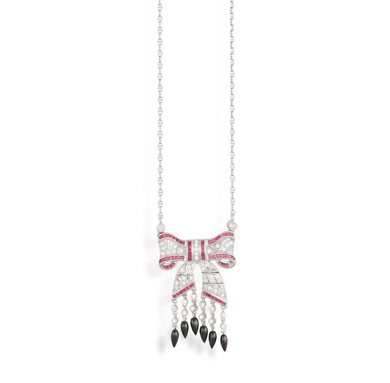 A ruby, onyx and diamond pendant necklace, €700-€900, at Adam's Jewellery Box online auction