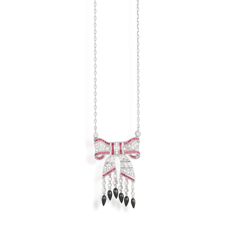 A ruby, onyx and diamond pendant necklace, €700-€900, at Adam's Jewellery Box online auction