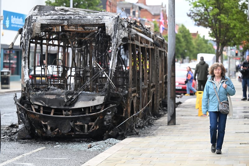 A burnt-out bus on Newtownards Road in Belfast. Photograph: Charles McQuillan/Getty Images