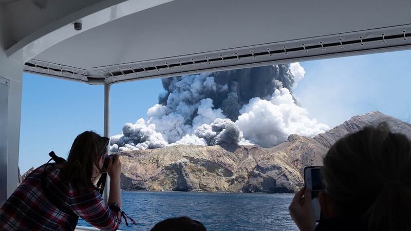 This handout photograph courtesy of Michael Schade shows the volcano on New Zealand’s White Island spewing steam and ash moments after it erupted on Monday. Photograph: Michael Schade/AFP