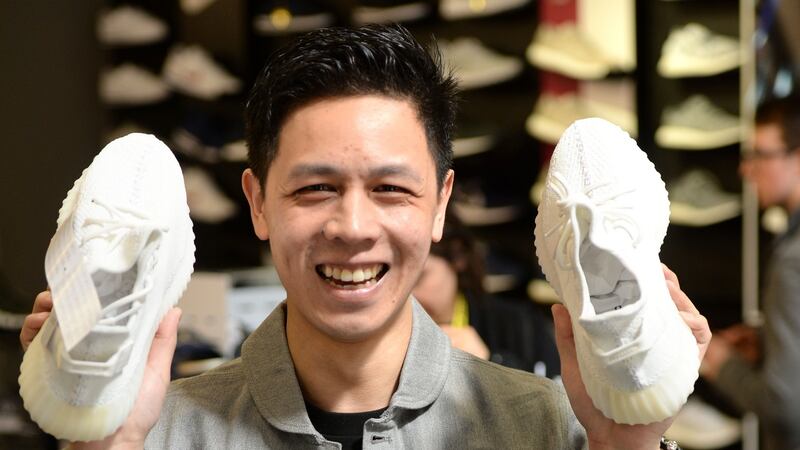 Simon Wai, a self-confessed sneakerhead  from Marino, Dublin, with the Yeezy Boost 350 by Adidas/Kanye West at a JD Sports, in Dublin. Photograph: Dara Mac Dónaill