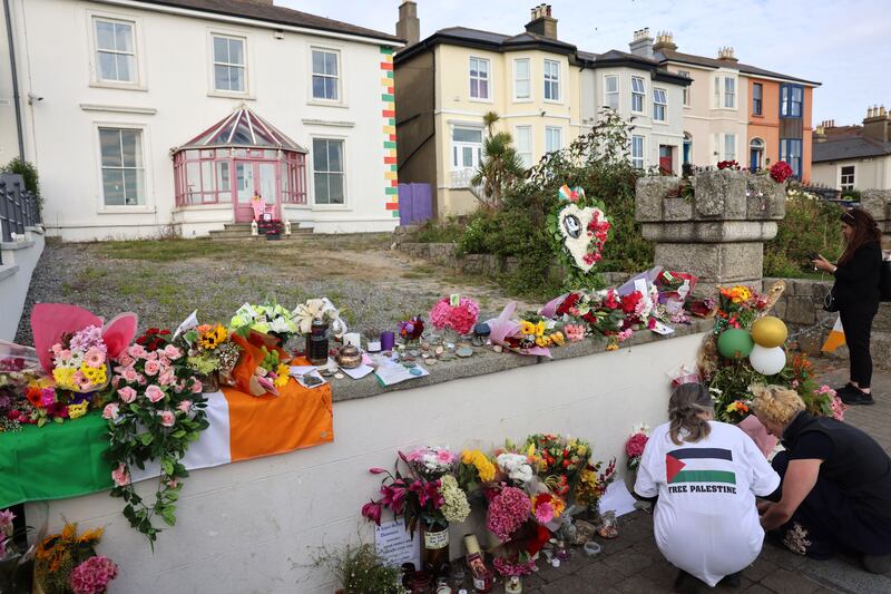 People gather at the former home of O’Connor, before her funeral cortege makes its way through Bray. Photograph: Dara Mac Dónaill 







