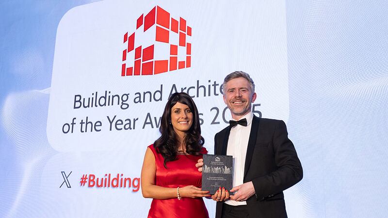 Sophie Lordan, customer service manager of Vescom, presents the conservation award for a single building or development award to Séamus Guidera, RKD