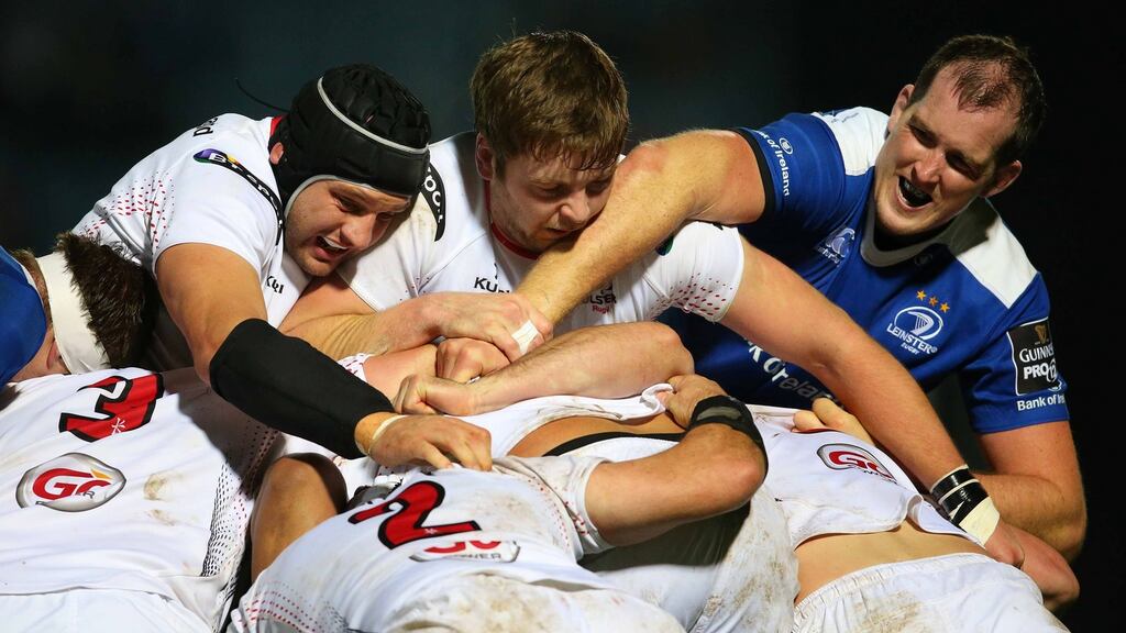 Leinster’s Devin Toner attempts to win the ball from Dan Tuohy and Iain Henderson of Ulster during their Pro12 clash. Photo: Billy Stickland/Ipnho