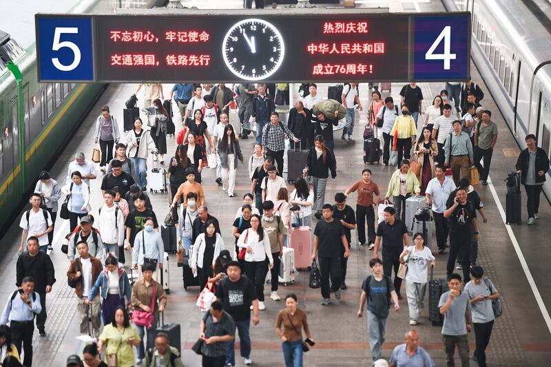 Commuters at Nanjing Railway Station in Nanjing, Jiangsu Province, China. Photograph: Costfoto/NurPhoto via Getty Images