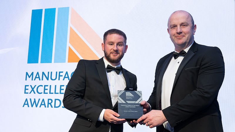 Adam Kane, community lead at Business River, presents the manufacturer of the year - large business award to James O'Neill, Astellas Ireland (Kerry Plant)