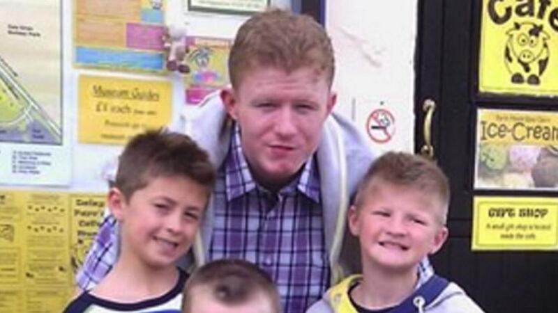 Jonathan O’Driscoll (22) with his younger twin brothers, Patrick and Tommy (9).
