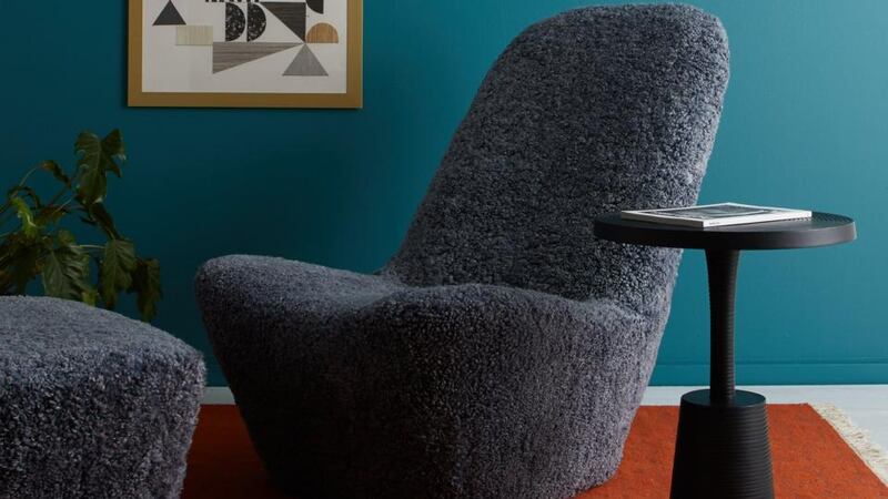 Fox is a grey sheepskin slipper chair.