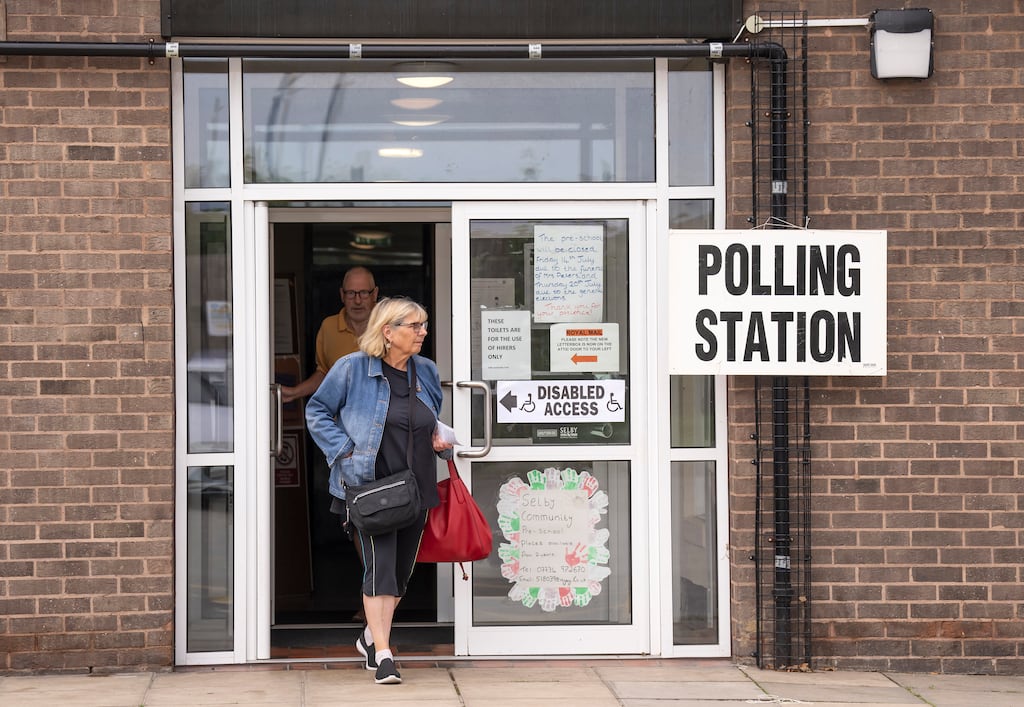 Voters leave the Selby Community Centre in North Yorkshire after casting their ballots in the Selby and Ainsty by-election. Photograph: Danny Lawson/PA Wire