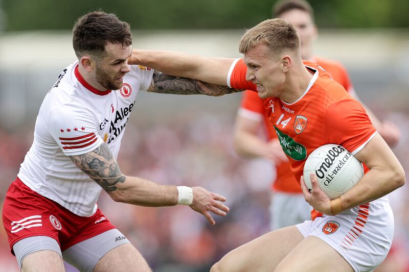 Tyrone's Matthew Donnelly and Aidan Forker of Armagh clash at the Athletic Grounds, Armagh. Photograph: Laszlo Geczo/Inhpo
