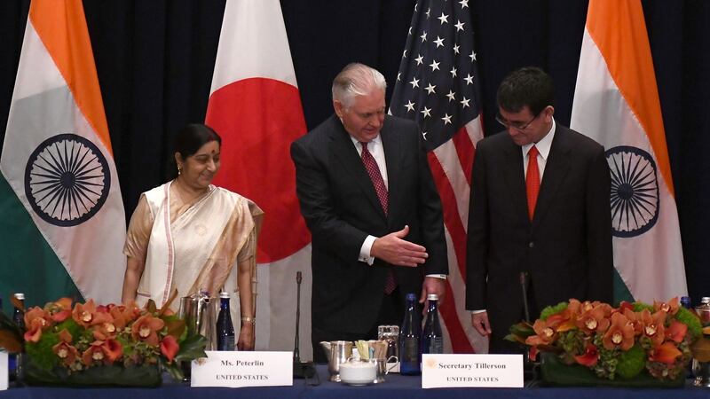 US secretary of state Rex Tillerson shakes hands with Japan’s foreign minister, Taro Kono, as India’s foreign minister, Sushma Swaraj, looks on before a meeting on the sideline of the United Nations General Assembly in New York. Photograph: Jewel Samad/AFP/Getty Images