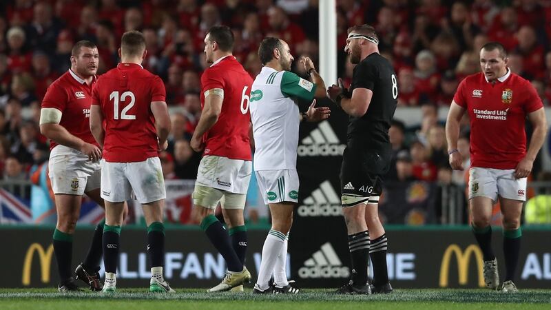 Romain Poite talks to All Black captain, Kieran Read after he reverses his penalty  decision. Photograph: David Rogers/Getty Images