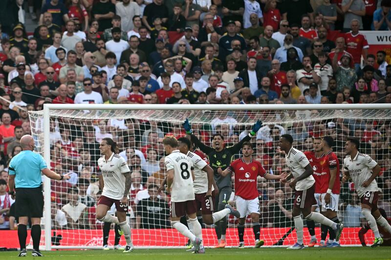Arsenal defender Riccardo Calafiori (left) celebrates after scoring what proved to be the winning goal against Manchester United at Old Trafford on Sunday. Photograph: Paul Ellis/AFP via Getty Images