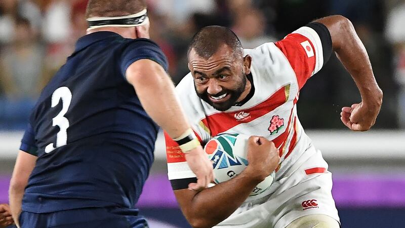 Japan captain  Michael Leitch  attempts to carry the ball past Scotland prop WP Nel during the  Rugby World Cup Pool A match at the International Stadium in  Yokohama. Photograph: William West/AFP via Getty Images
