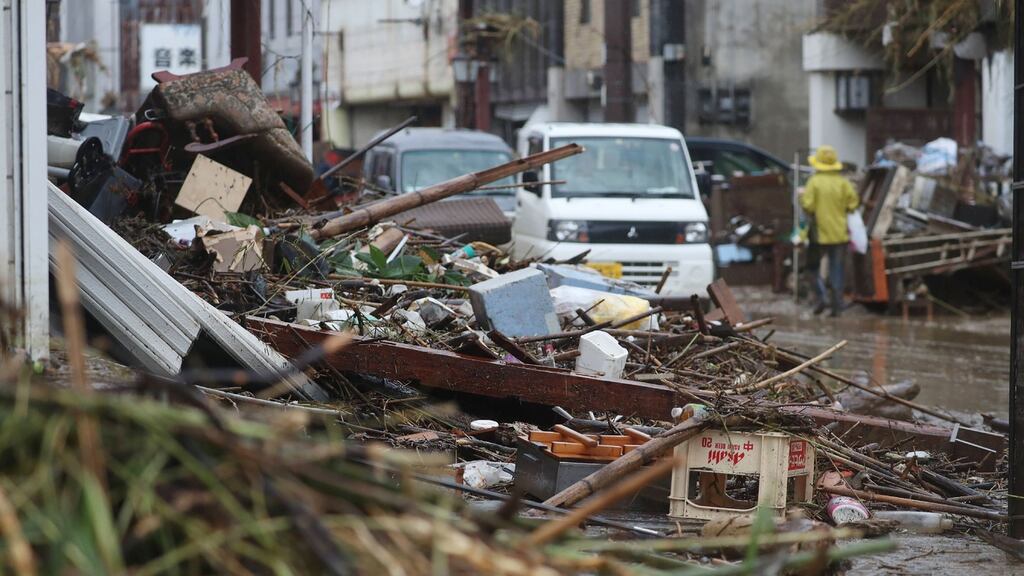 A street covered by debris in a flood-affected area following torrential rain in Hitoyoshi, Kumamoto prefecture. Photograph: STR/JIJI PRESS/AFP via Getty