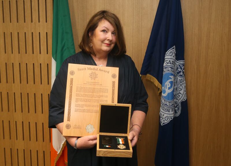 Meabh McKeown, granddaughter of late Det Sgt Denis O'Brien,  at a ceremony to award deceased, retired and serving members of An Garda Síochána with Scott Medals for bravery, at Walter Scott House, Military Road, Dublin 8, on Monday. Photograph: Stephen Collins/Collins Photos