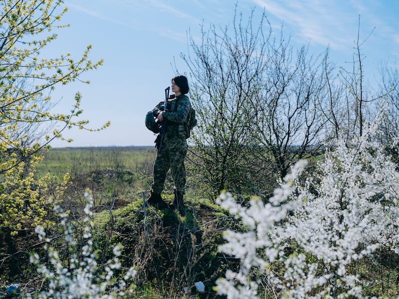 Lt Yulia Mykytenko stands among spring blossom in Donetsk, Eastern Ukraine