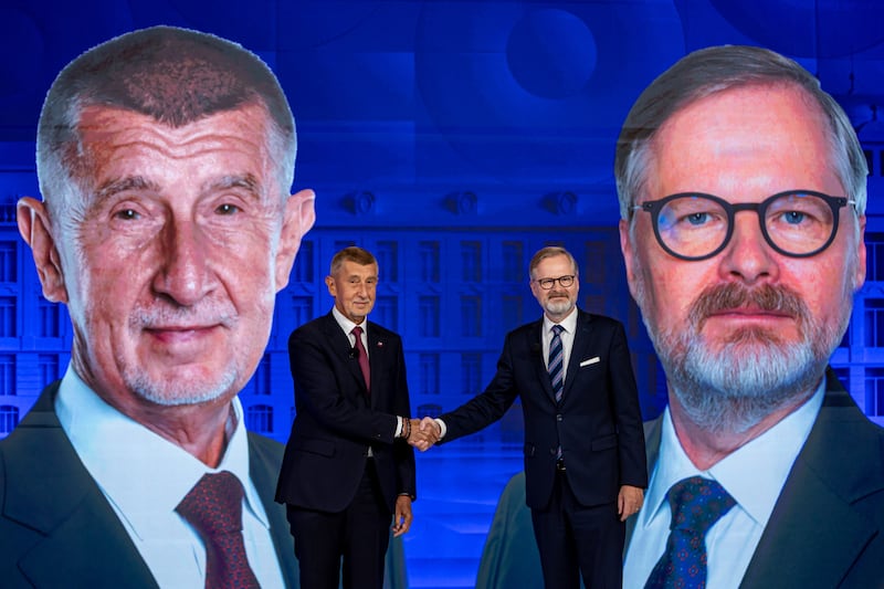 Andrej Babis (left) and incumbent Czech prime minister Petr Fiala shake hands before a televised debate at CNN Prima News in Prague on Wednesday. Photograph: Martin Divisek/EPA