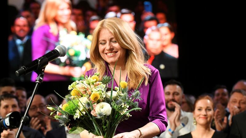 Zuzana Caputova receives flowers after winning the presidential election. Photograph: Radovan Stoklasa/Reuters