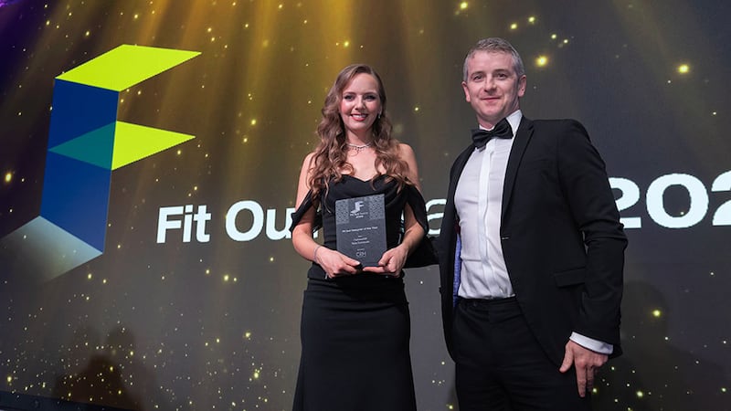 Enda Gallagher, commercial director at CRM Interior Fit-Outs, presents the fit out designer of the year award to Rasa Zubrickaite, Perkins & Will