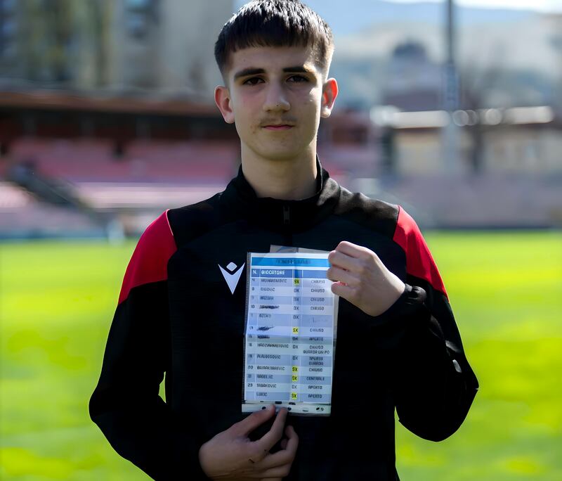 Bosnia & Herzegovina ball-boy Afan Cizmic with Gianluigi Donnarumma's 'cheat-sheet'. Photograph: Denis Zuberi/Anadolu