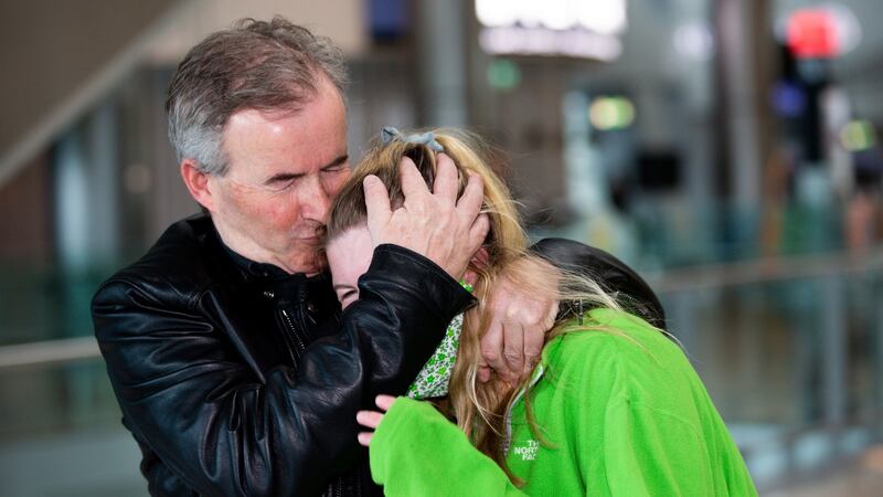Sarah McKernan from Dublin is hugged by her father, Robert McKernan, after coming back from Peru. Photograph: Tom Honan/The Irish Times.