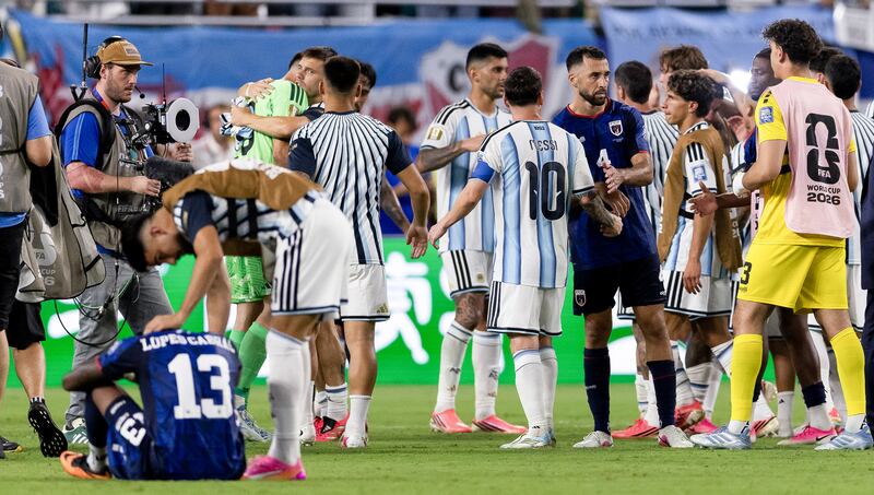 Pico Lopes shakes hands with Argentina's Lionel Messi after the game. Photograph: Luciano Bisbal/Inpho