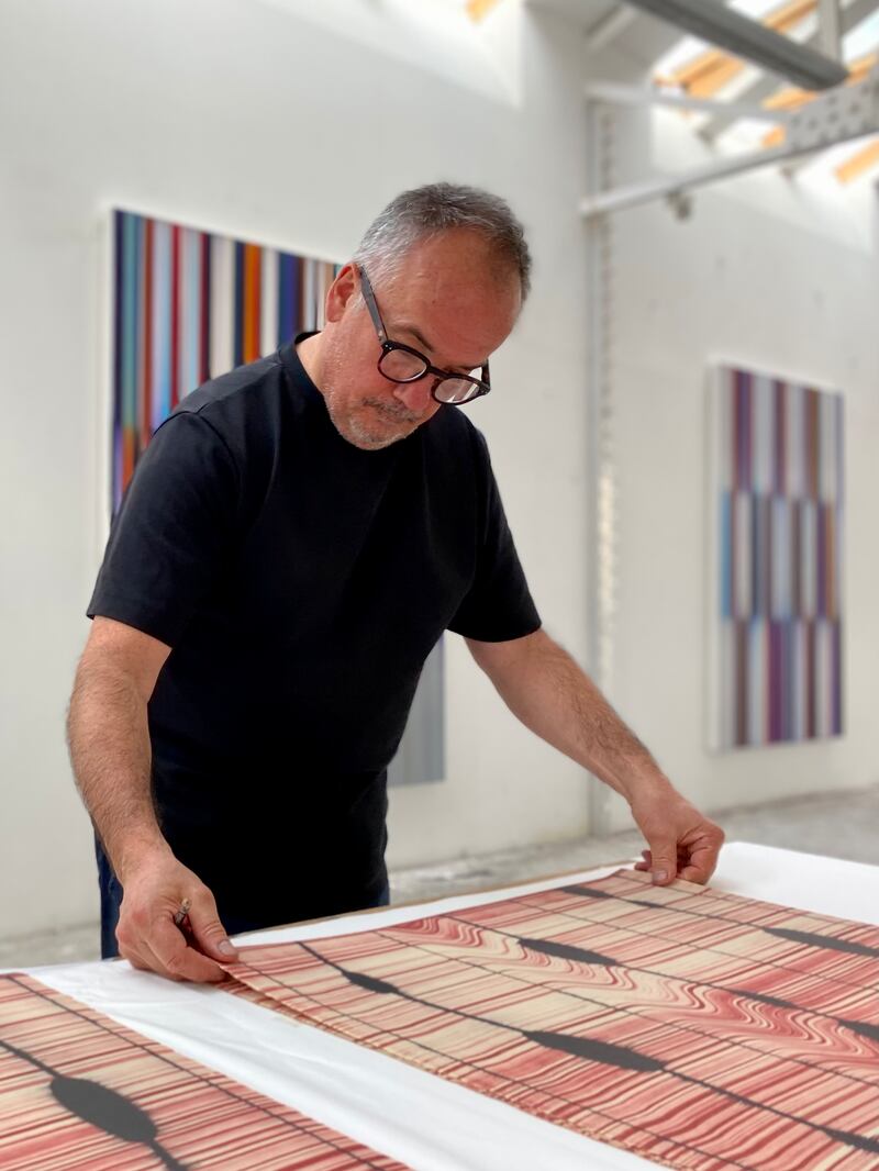 Visiting Artists 2023: Mark Francis, in his studio in London, signs prints for Graphic Studio Dublin's exhibition
