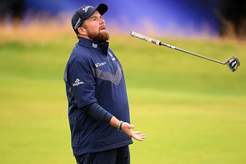 Shane Lowry reacts on the 18th green after missing a putt. Photograph: Ross Kinnaird/Getty
