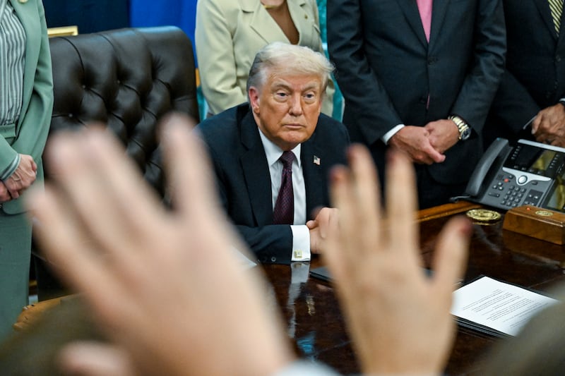 US president Donald Trump speaks to reporters in the Oval Office of the White House on Monday. Photograph: Kenny Holston/The New York Times