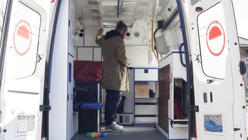 Michael Lodberg Olsen inside the  repurposed ambulance dubbed “Sexelance”. Photograph:   Thomson Reuters Foundation/Lin Taylor